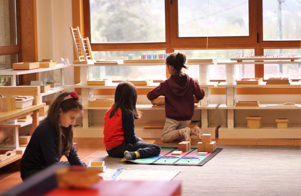Children working with Montessori materials